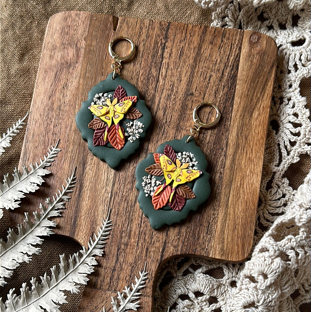 Comet moth and floral framed earrings