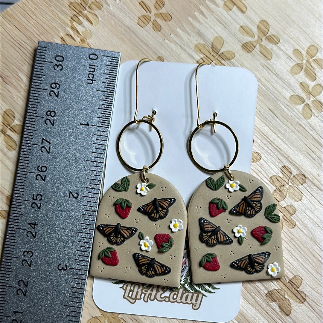 Monarch and strawberry arches
