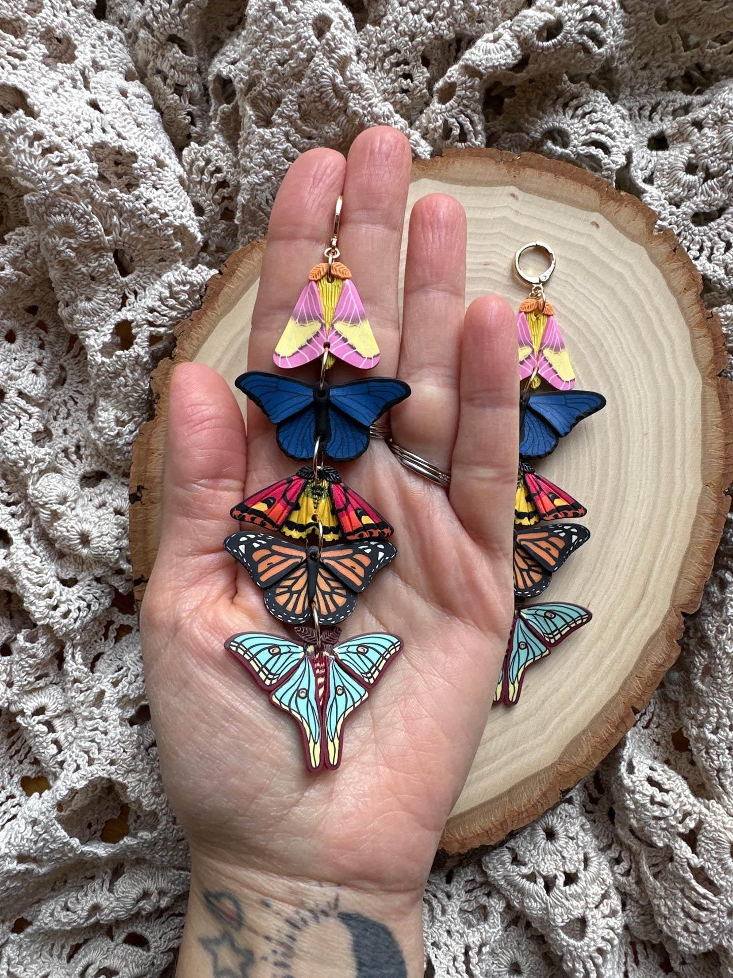 Stacked butterfly and moth dangles