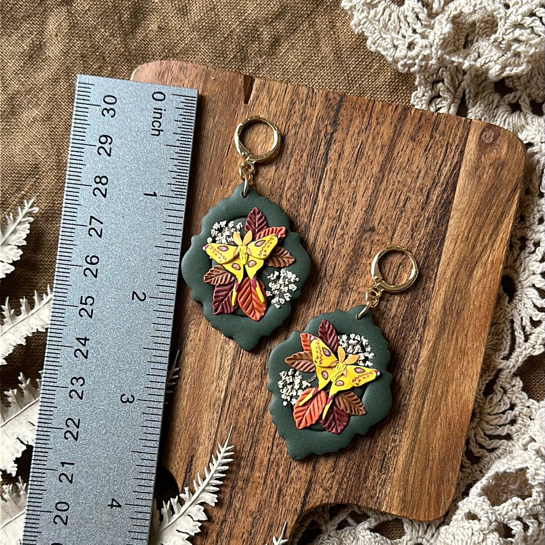 Comet moth and floral framed earrings