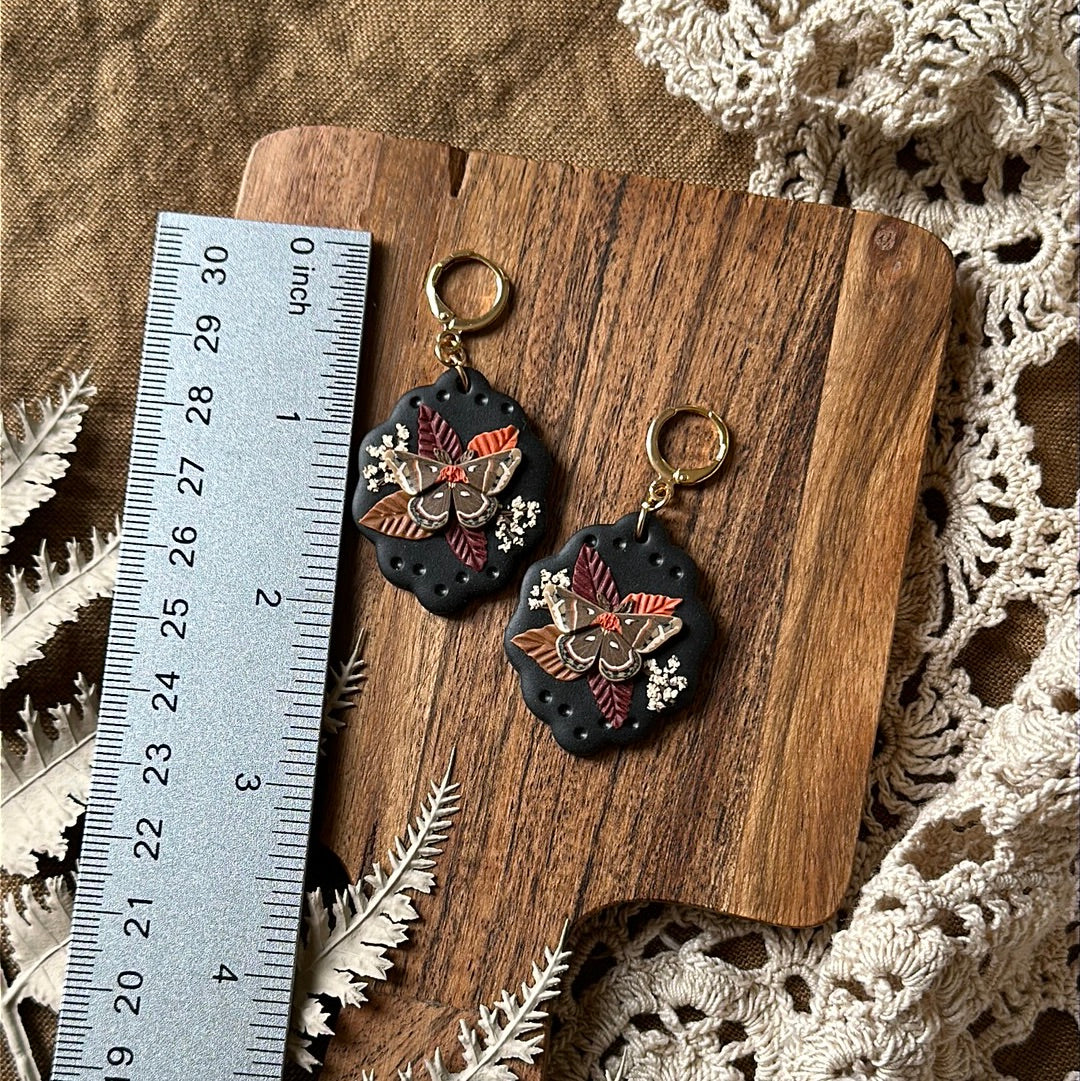 Floral cecropia moth scallop framed earrings
